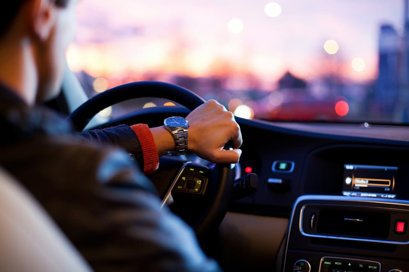 Chauffeur checking the time before an airport pickup